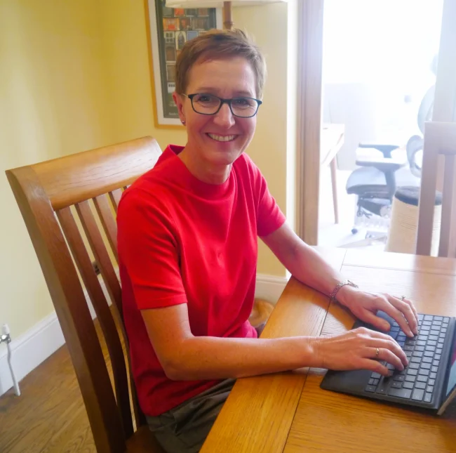 Carrie during an online counselling session with her laptop on the table - counsellor in Sittingbourne, Kent