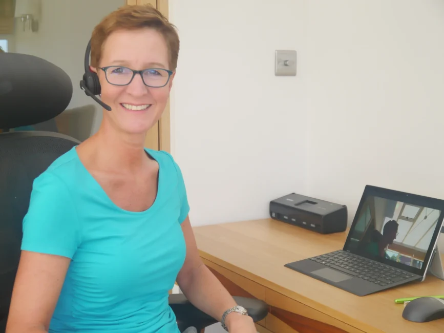 Carrie during an online counselling session with her headset on- counsellor in Sittingbourne, Kent